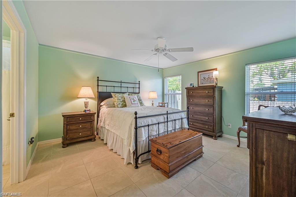 18546 Violet Road Fort Myers, FL 33967 - Photo 18 of 38 a bedroom with a bed and a dresser