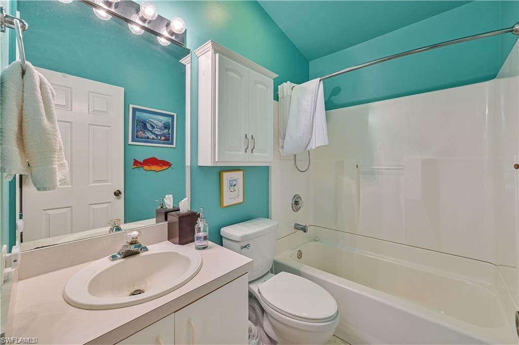 18546 Violet Road Fort Myers, FL 33967 - Photo 26 of 38 a bathroom with a sink toilet and shower