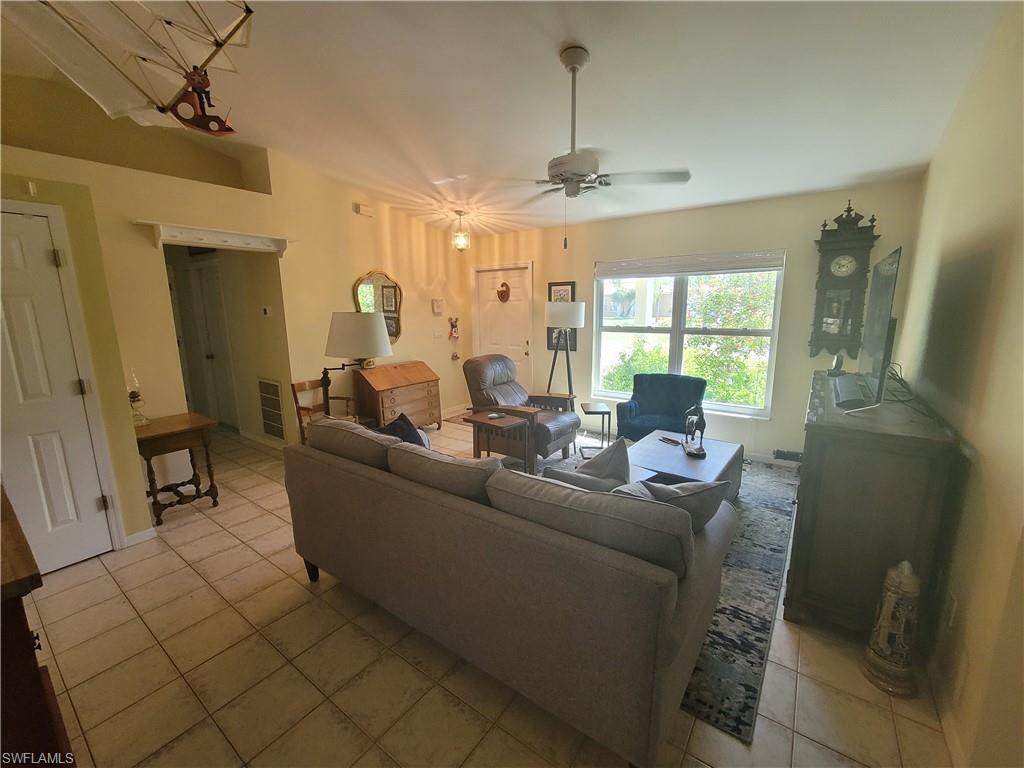 18546 Violet Road Fort Myers, FL 33967 - Photo 29 of 38 a living room with furniture and a chandelier