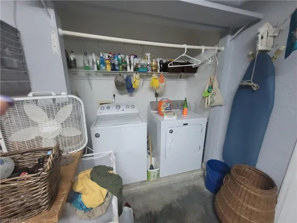 a utility room with dryer and washer