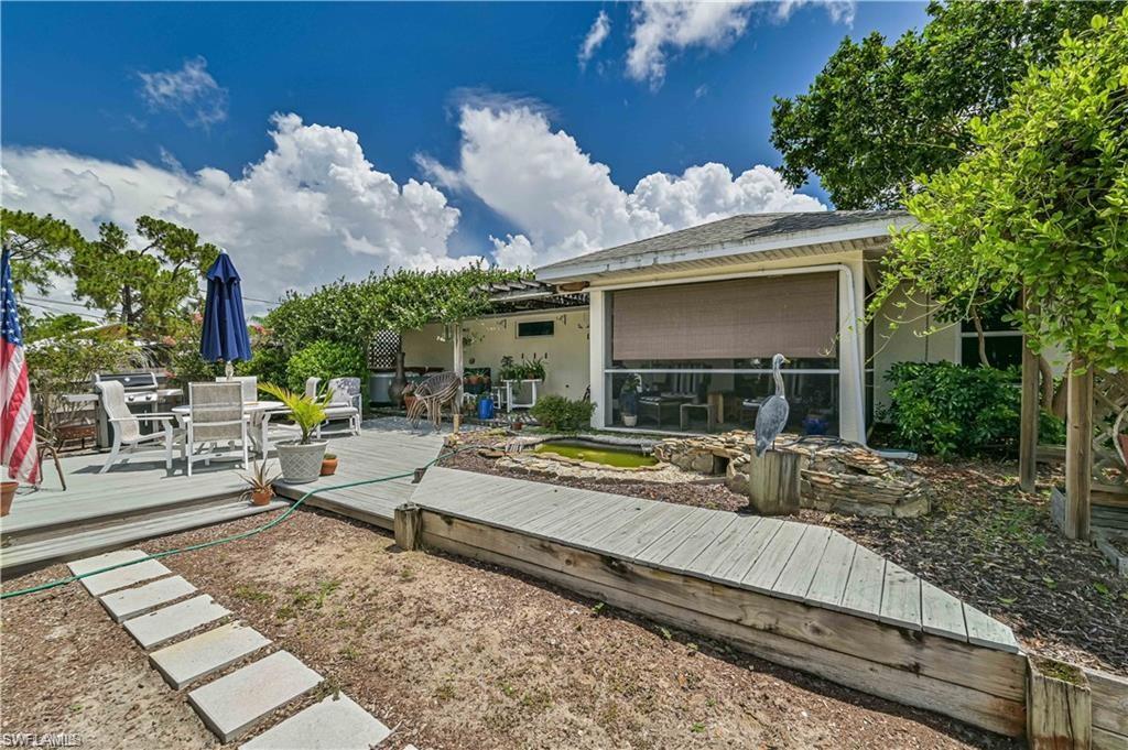 18546 Violet Road Fort Myers, FL 33967 - Photo 3 of 38 a view of a house with backyard and sitting area