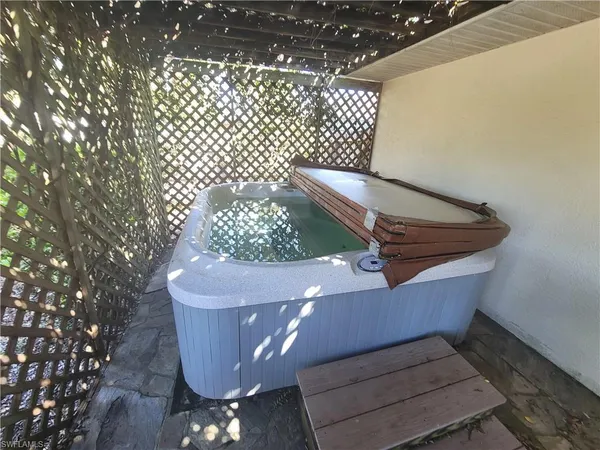 a view of a swimming pool with a patio