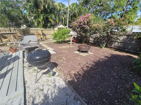 a view of a backyard with sitting area