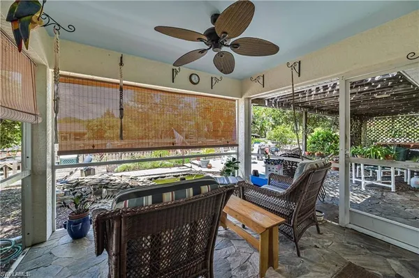 a view of a chairs and table in a patio