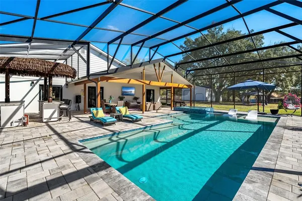 a view of a swimming pool with a patio