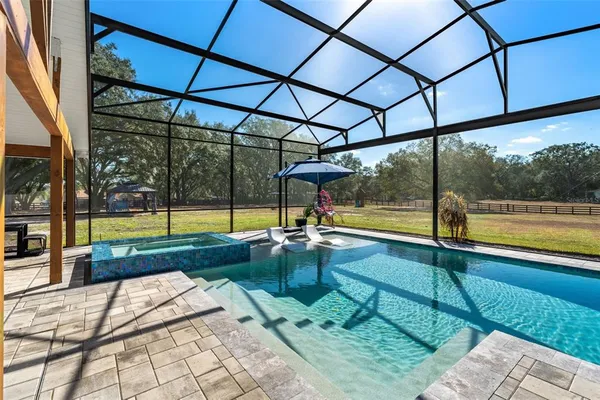 a view of swimming pool with a yard