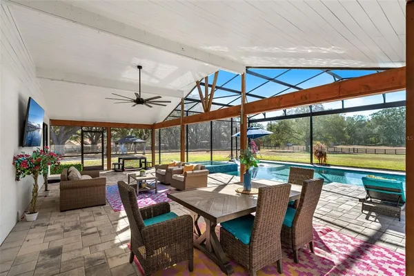 a view of a dining room with furniture window and outside view