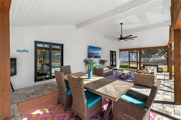 a view of a dining room with furniture window and outside view