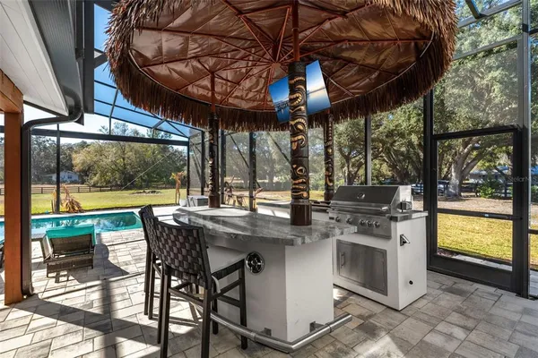 a view of a patio with a table and chairs