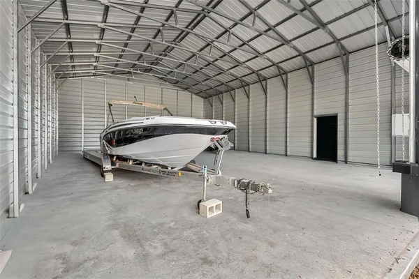a view of a patio with table and chairs