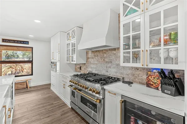 a kitchen with stainless steel appliances a stove and a refrigerator