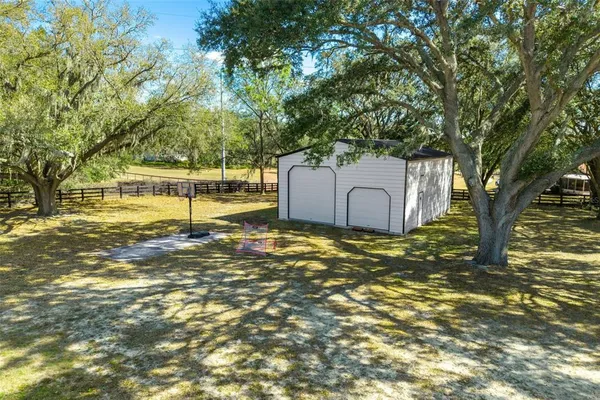 a view of yard with swimming pool