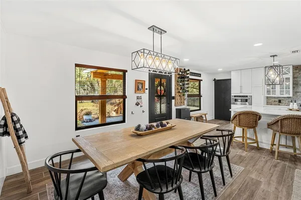 a view of a dining room with furniture window and wooden floor