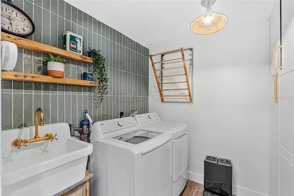 a utility room with dryer and washer