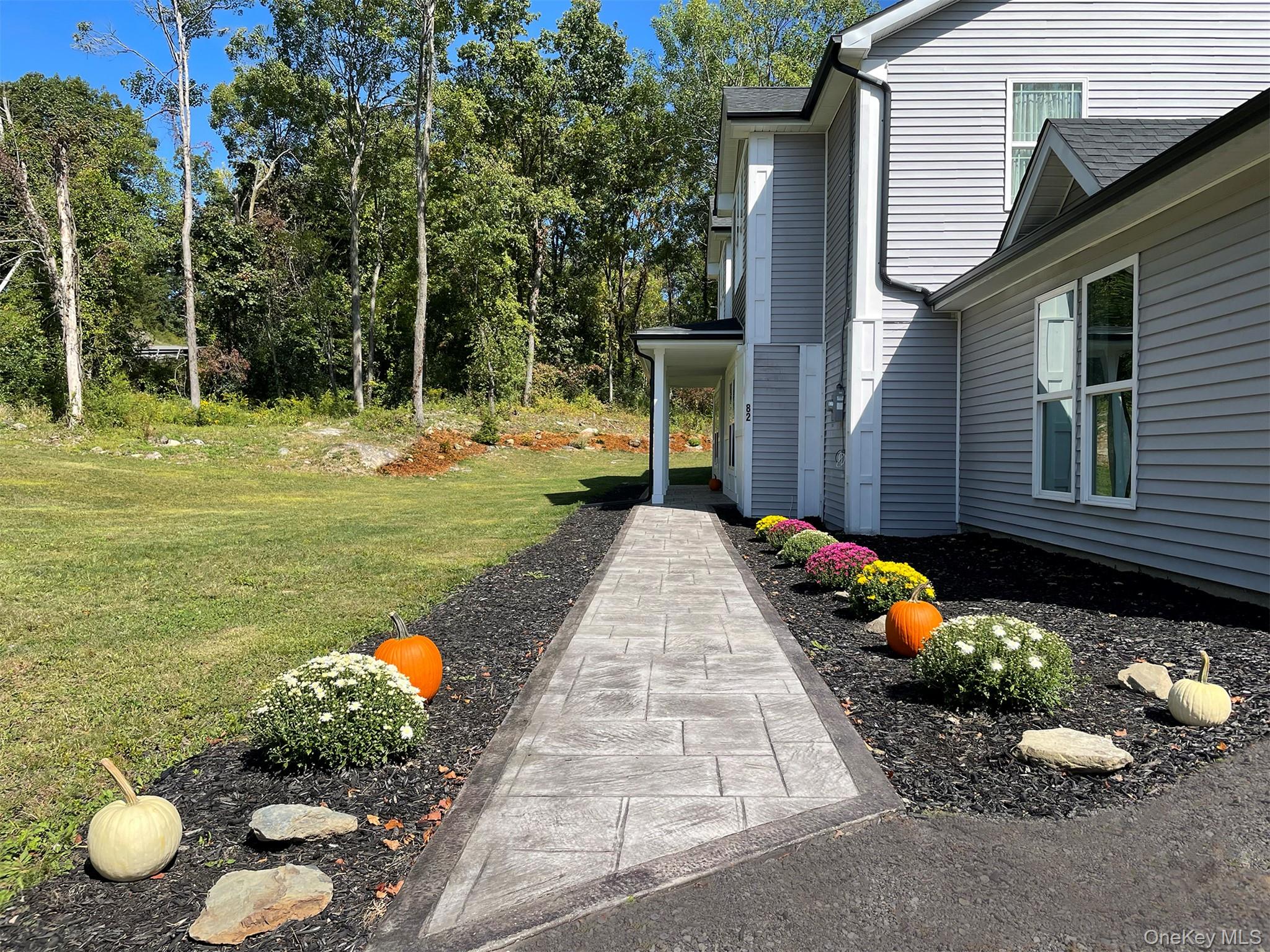 82 Hampton Road Marlboro, NY 12542 - Photo 37 of 39 Stone pathway leads to front entrance, lined with flowers