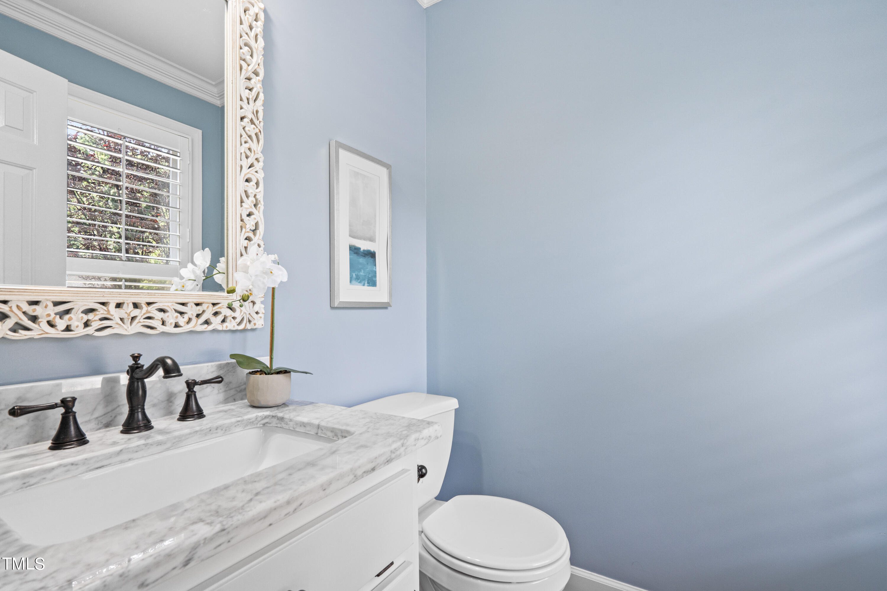 2917 Dahlgreen Road Raleigh, NC 27615 - Photo 27 of 36 a bathroom with a granite countertop toilet sink and mirror