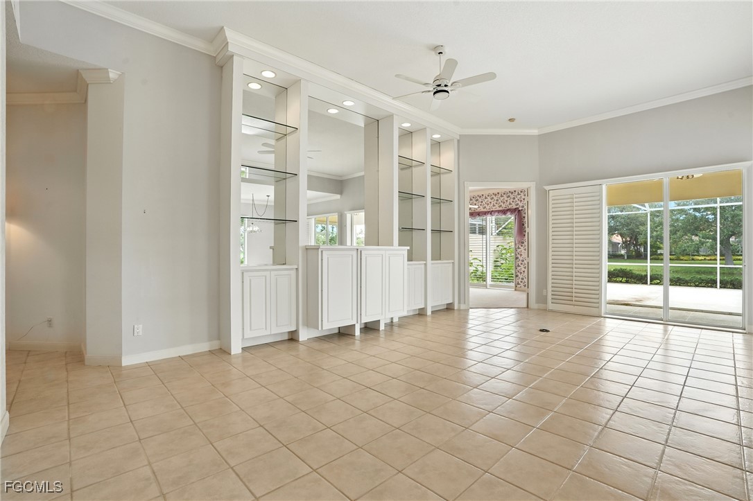 4017 Isla Ciudad Court Naples, FL 34109 - Photo 15 of 36 a view of empty room with wooden floor and fan