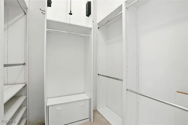 a bathroom with a double vanity sink toilet and shower