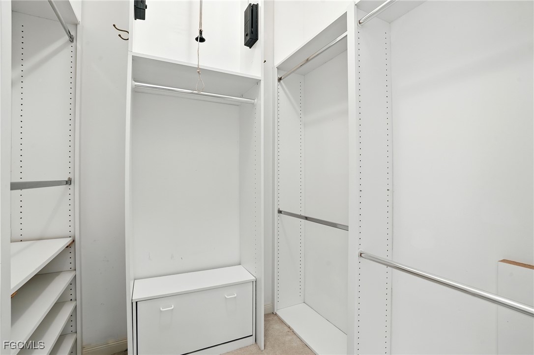 4017 Isla Ciudad Court Naples, FL 34109 - Photo 18 of 36 a bathroom with a shower and a sink