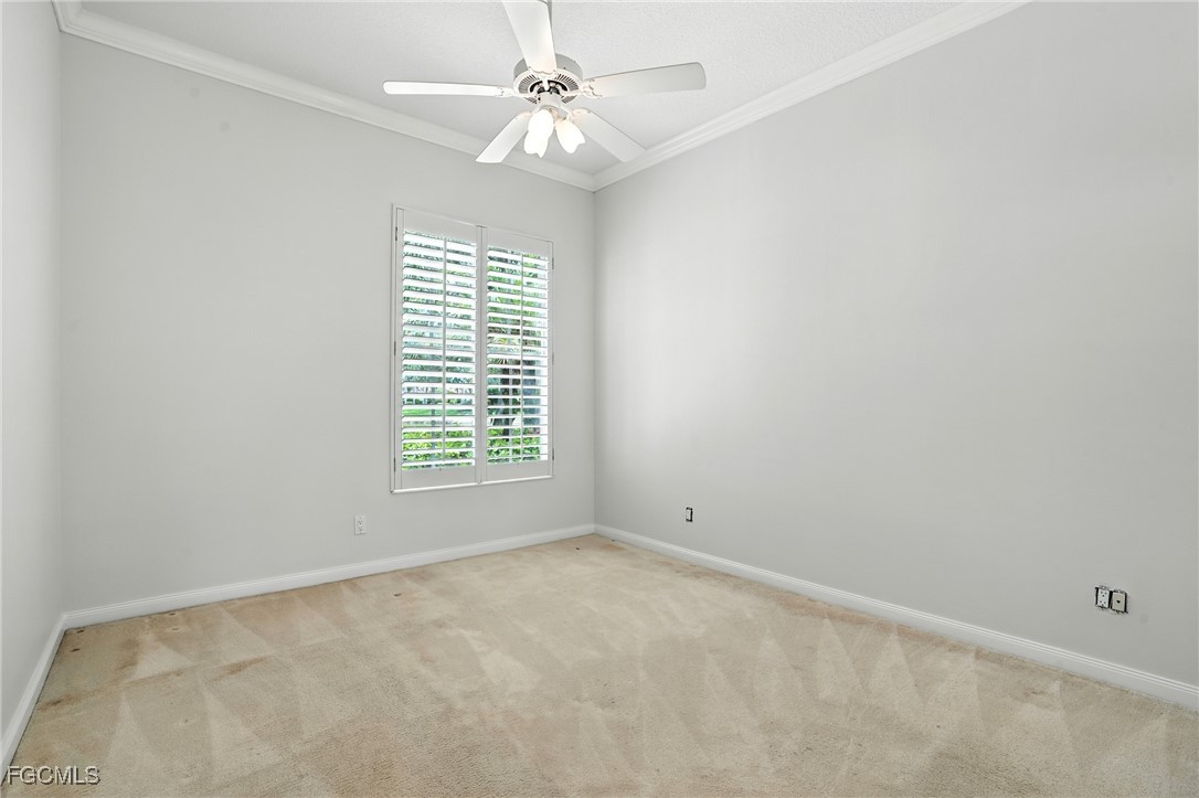 4017 Isla Ciudad Court Naples, FL 34109 - Photo 25 of 36 an empty room with windows and fan