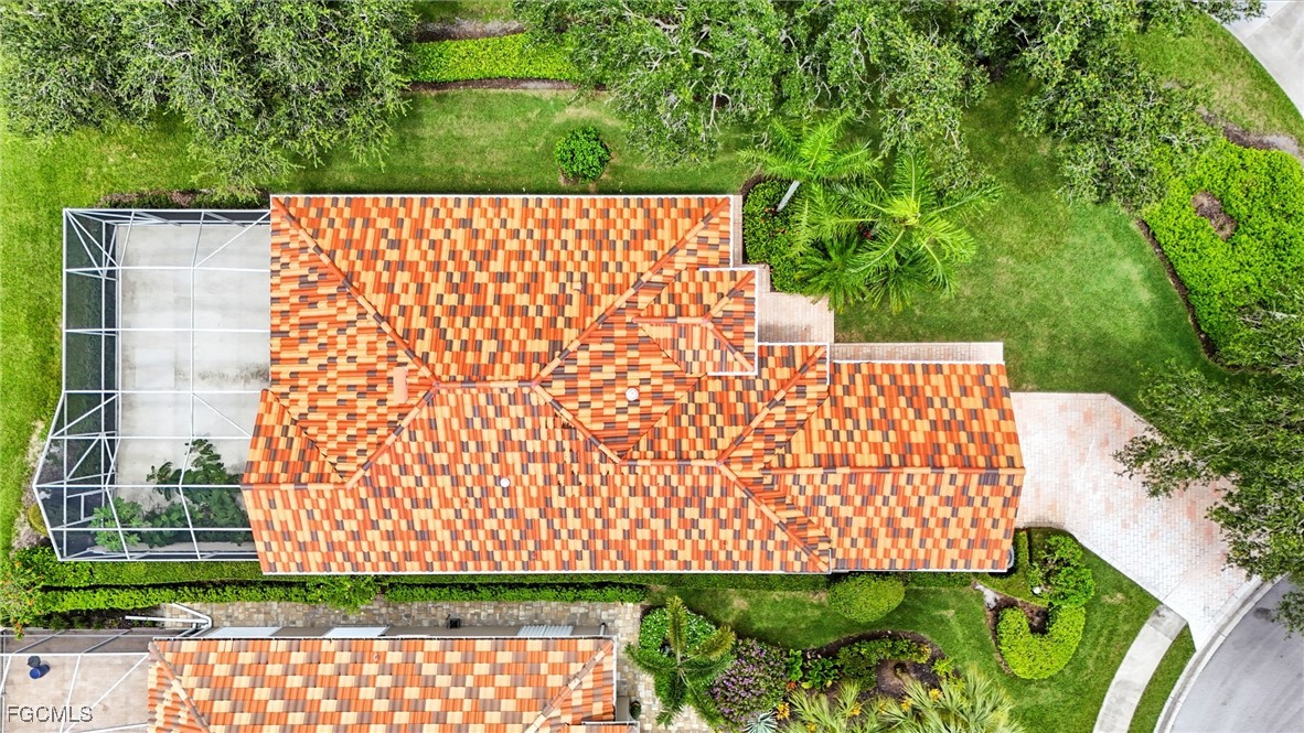 4017 Isla Ciudad Court Naples, FL 34109 - Photo 28 of 36 a view of an outdoor space with a garden