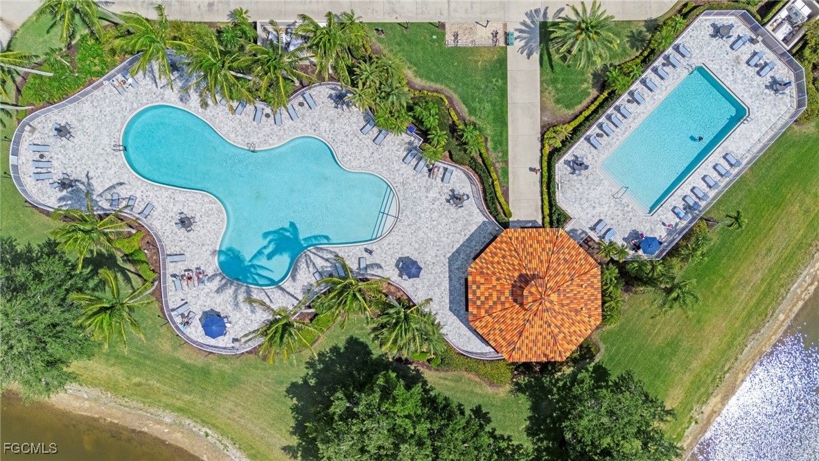 4017 Isla Ciudad Court Naples, FL 34109 - Photo 30 of 36 an aerial view of a swimming pool patio swimming pool and outdoor seating