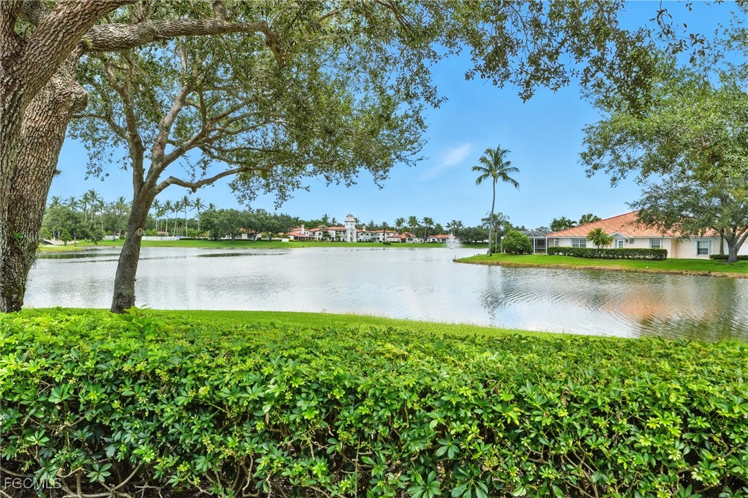 4017 Isla Ciudad Court Naples, FL 34109 - Photo 4 of 36 a view of a lake with houses in the back
