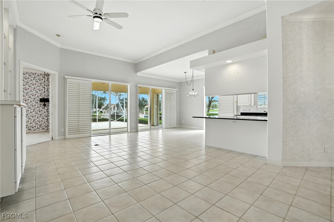 4017 Isla Ciudad Court Naples, FL 34109 - Photo 8 of 36 a view of an empty room and window