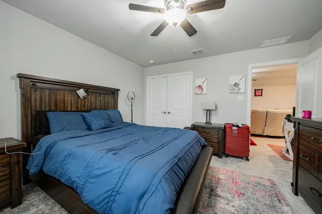 a bedroom with a bed and furniture