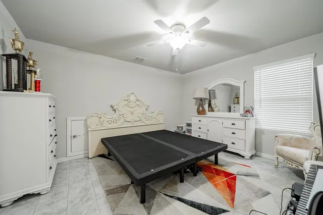 a living room with furniture and view of kitchen