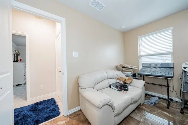 a living room with furniture and a window