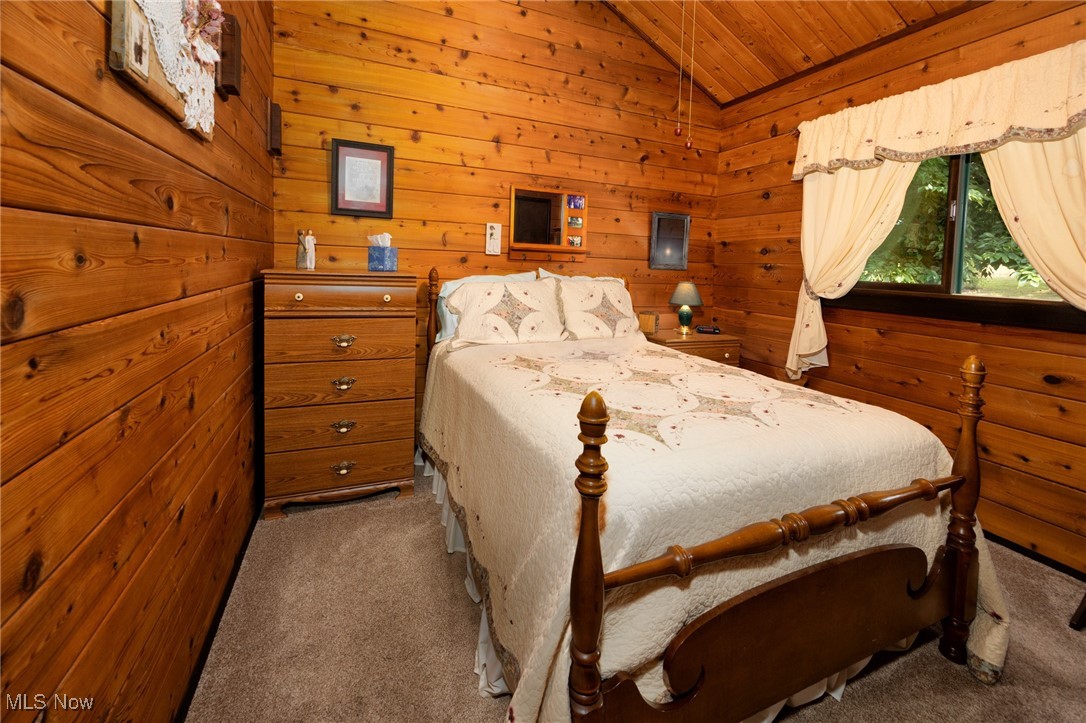 55901 Deep Run Road Martins Ferry, OH 43935 - Photo 21 of 50 Carpeted bedroom with vaulted ceiling, wooden ceiling, and wooden walls