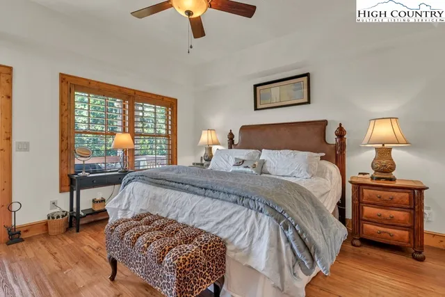 a bed room with a bed and a lamp