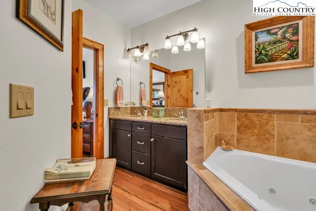 a bathroom with a bathtub and a sink