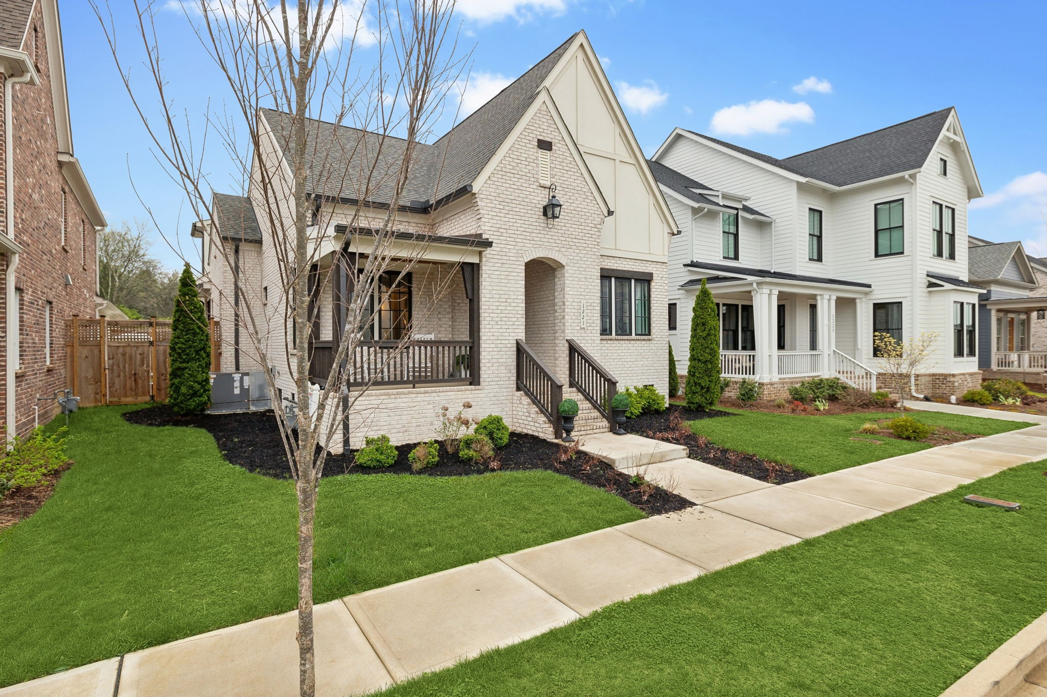 1221 Luckett Road Nashville, TN 37221 - Photo 1 of 59 a front view of a house with a yard and porch