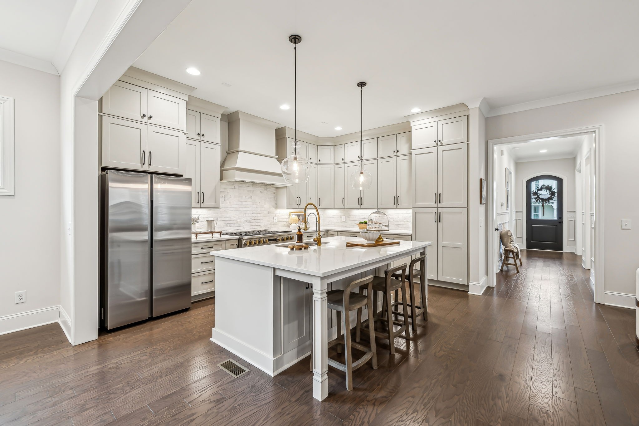 1221 Luckett Road Nashville, TN 37221 - Photo 16 of 59 a kitchen with a refrigerator a sink and a wooden floor