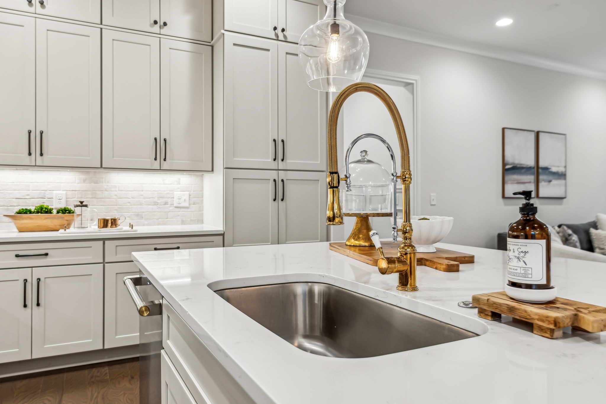 1221 Luckett Road Nashville, TN 37221 - Photo 19 of 59 a kitchen with a sink and a stove with wooden floor