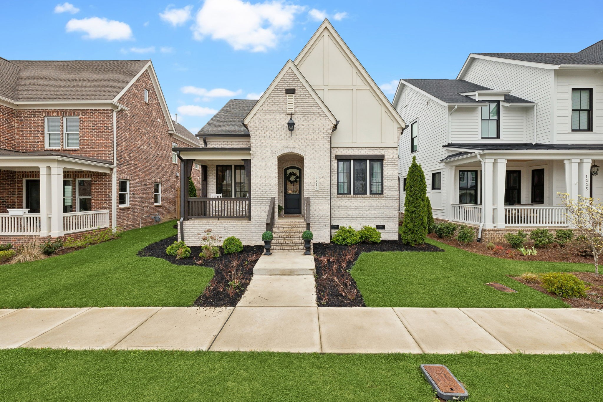 1221 Luckett Road Nashville, TN 37221 - Photo 2 of 59 front view of a house with a yard