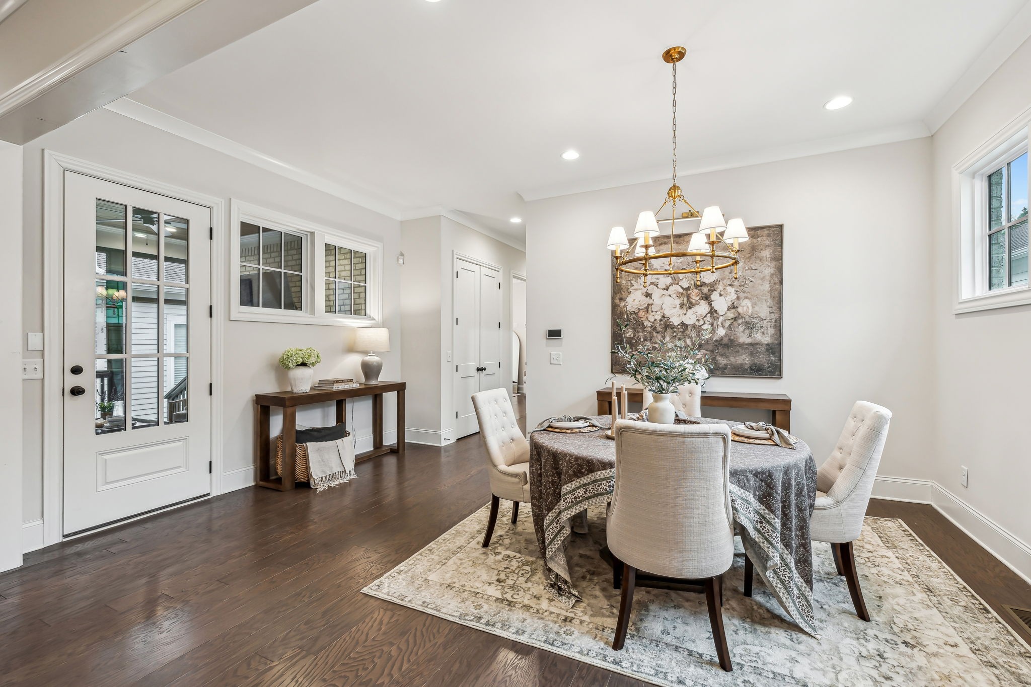 1221 Luckett Road Nashville, TN 37221 - Photo 23 of 59 a dining room with furniture a chandelier and wooden floor