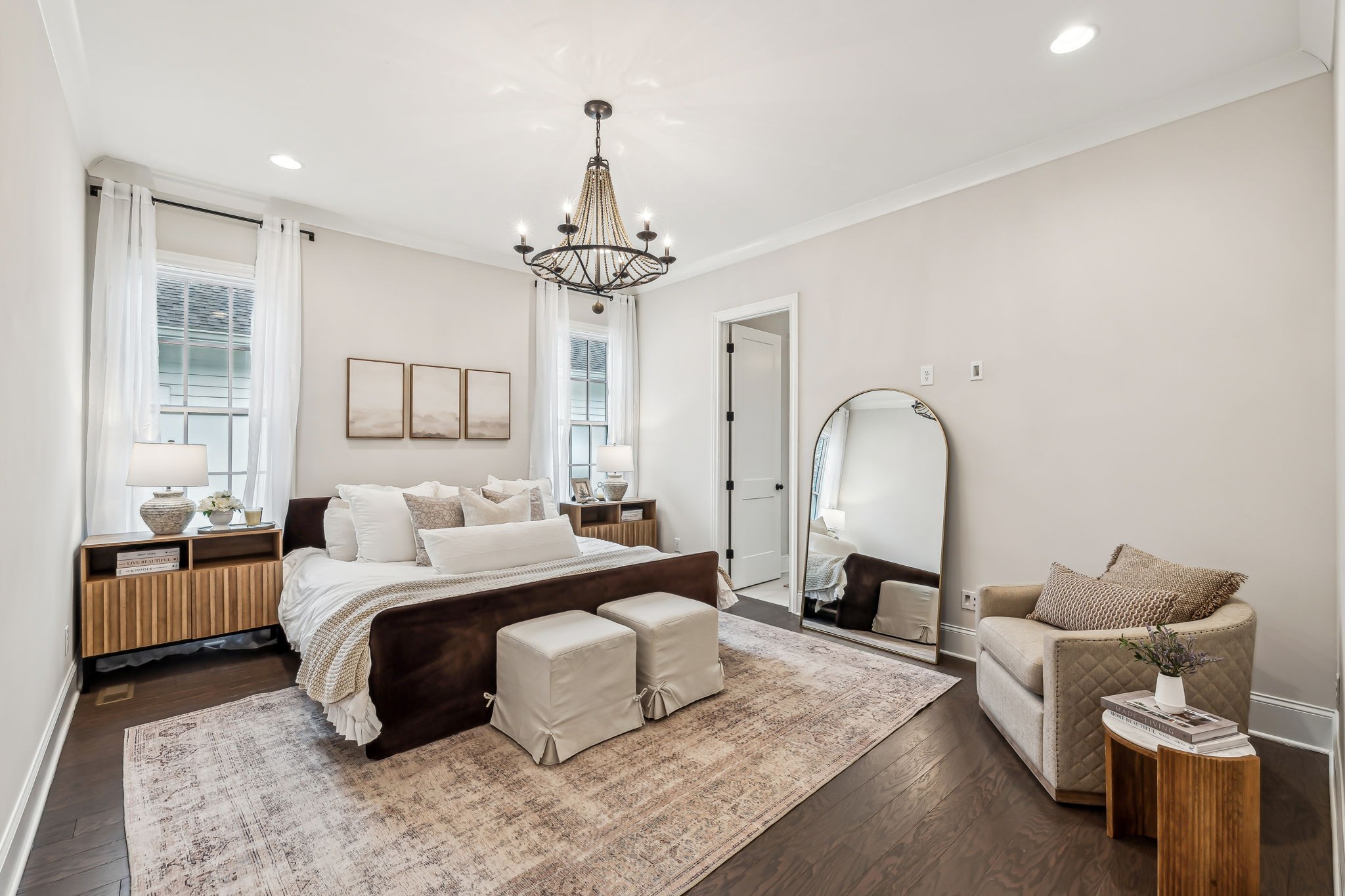 1221 Luckett Road Nashville, TN 37221 - Photo 28 of 59 a bed room with a bed and a chandelier