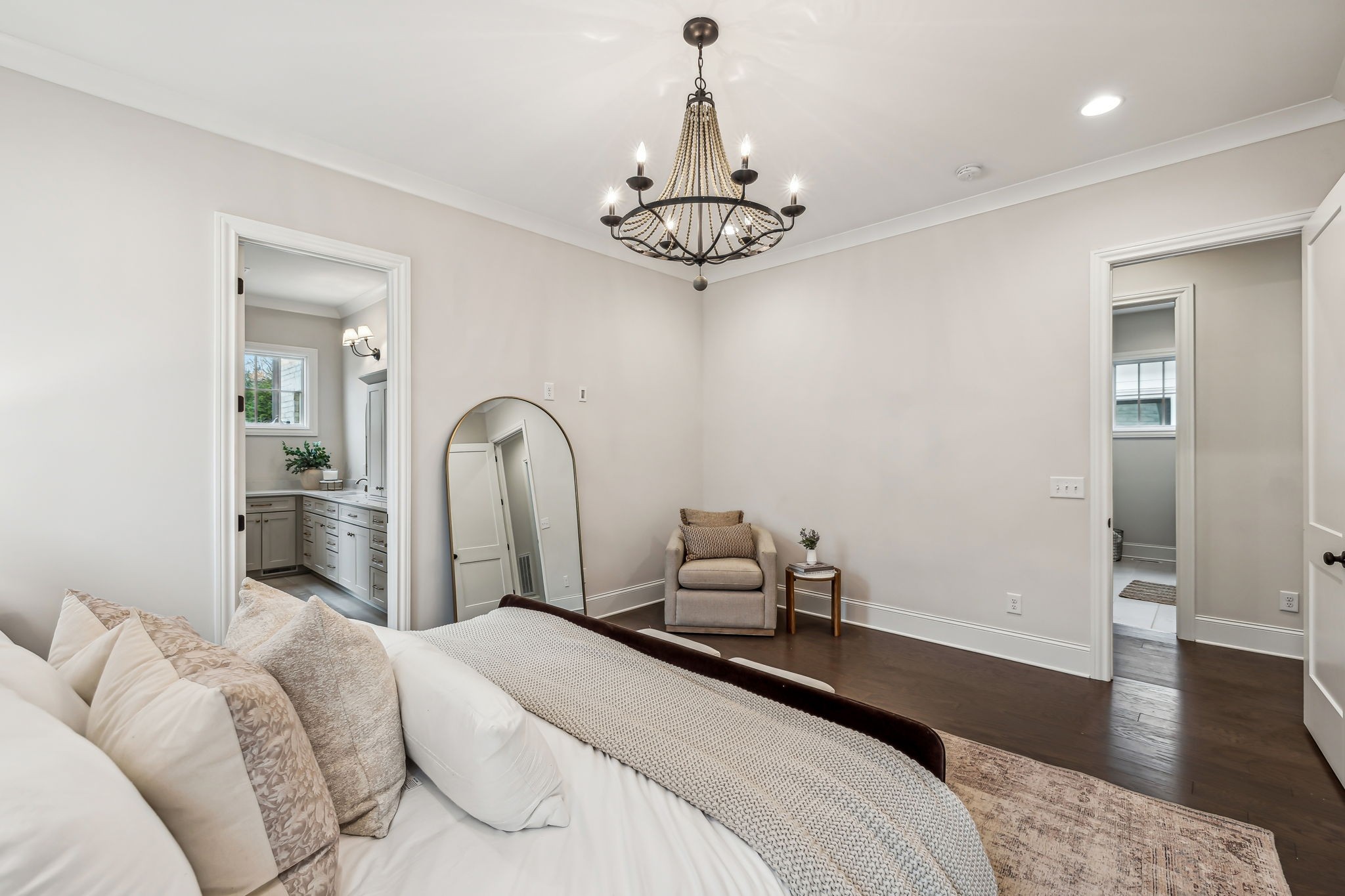 1221 Luckett Road Nashville, TN 37221 - Photo 30 of 59 a bedroom with a bed and a chandelier