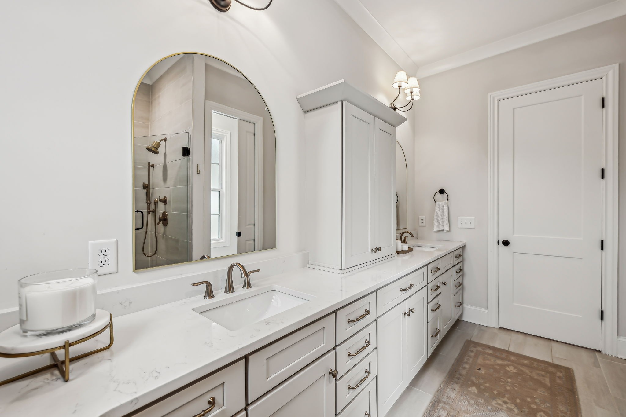 1221 Luckett Road Nashville, TN 37221 - Photo 32 of 59 a bathroom with a double vanity sink and a mirror