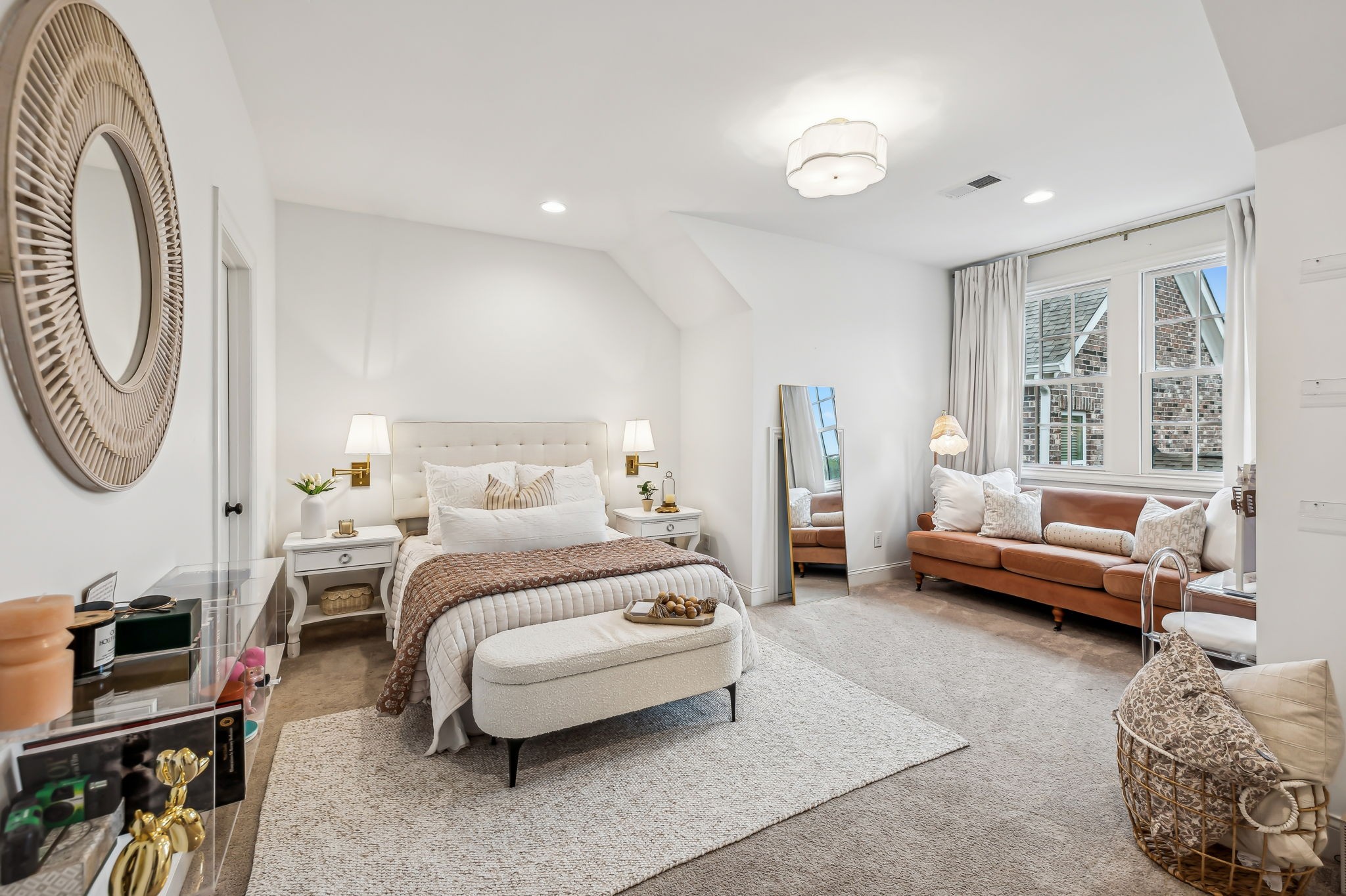 1221 Luckett Road Nashville, TN 37221 - Photo 41 of 59 a bedroom with a bed a couch and a chandelier