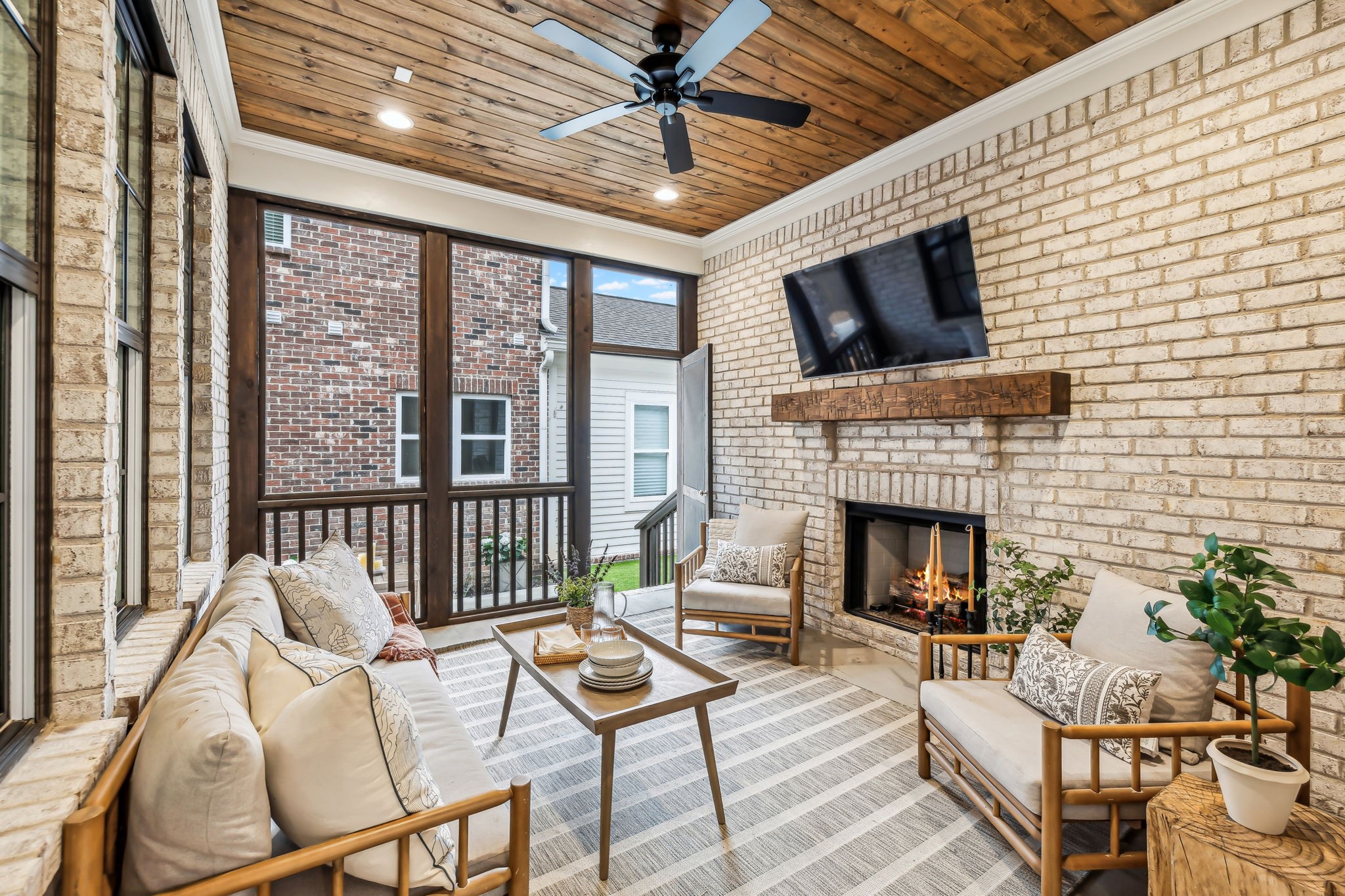 1221 Luckett Road Nashville, TN 37221 - Photo 44 of 59 a living room with furniture a flat screen tv and a fireplace