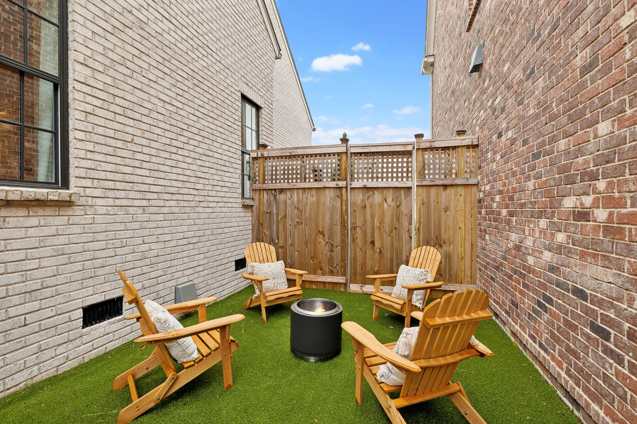 1221 Luckett Road Nashville, TN 37221 - Photo 48 of 59 a view of a patio with a table and chairs