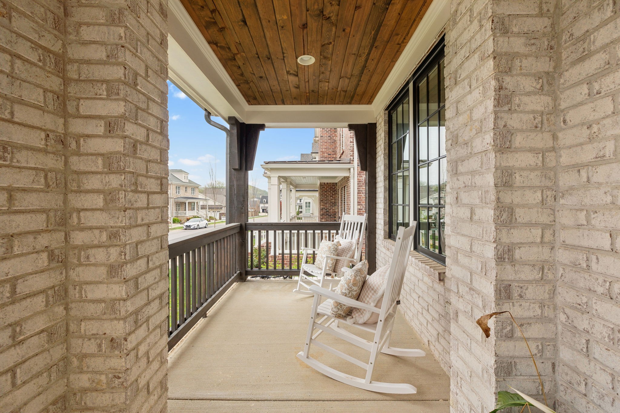 1221 Luckett Road Nashville, TN 37221 - Photo 5 of 59 a view of a patio with table and chairs and wooden floor