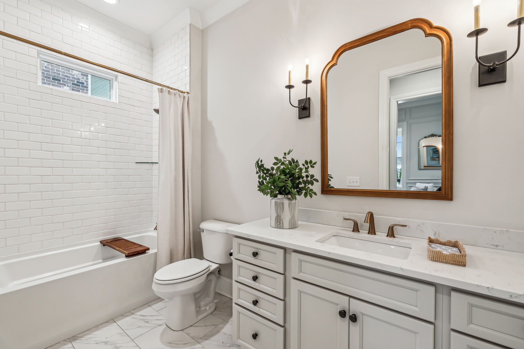 1221 Luckett Road Nashville, TN 37221 - Photo 10 of 59 a bathroom with a granite countertop toilet a sink and bathtub