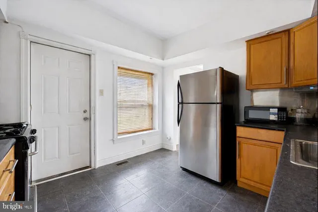 a refrigerator freezer sitting in a kitchen