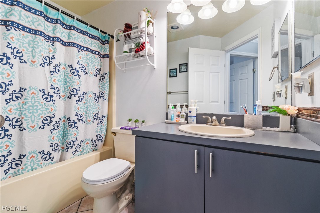 32 Lincoln Avenue Lehigh Acres, FL 33936 - Photo 13 of 32 a bathroom with a sink toilet and shower
