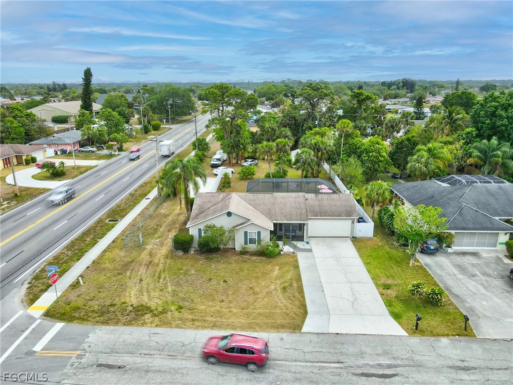 32 Lincoln Avenue Lehigh Acres, FL 33936 - Photo 28 of 32 a view of a swimming pool with a yard
